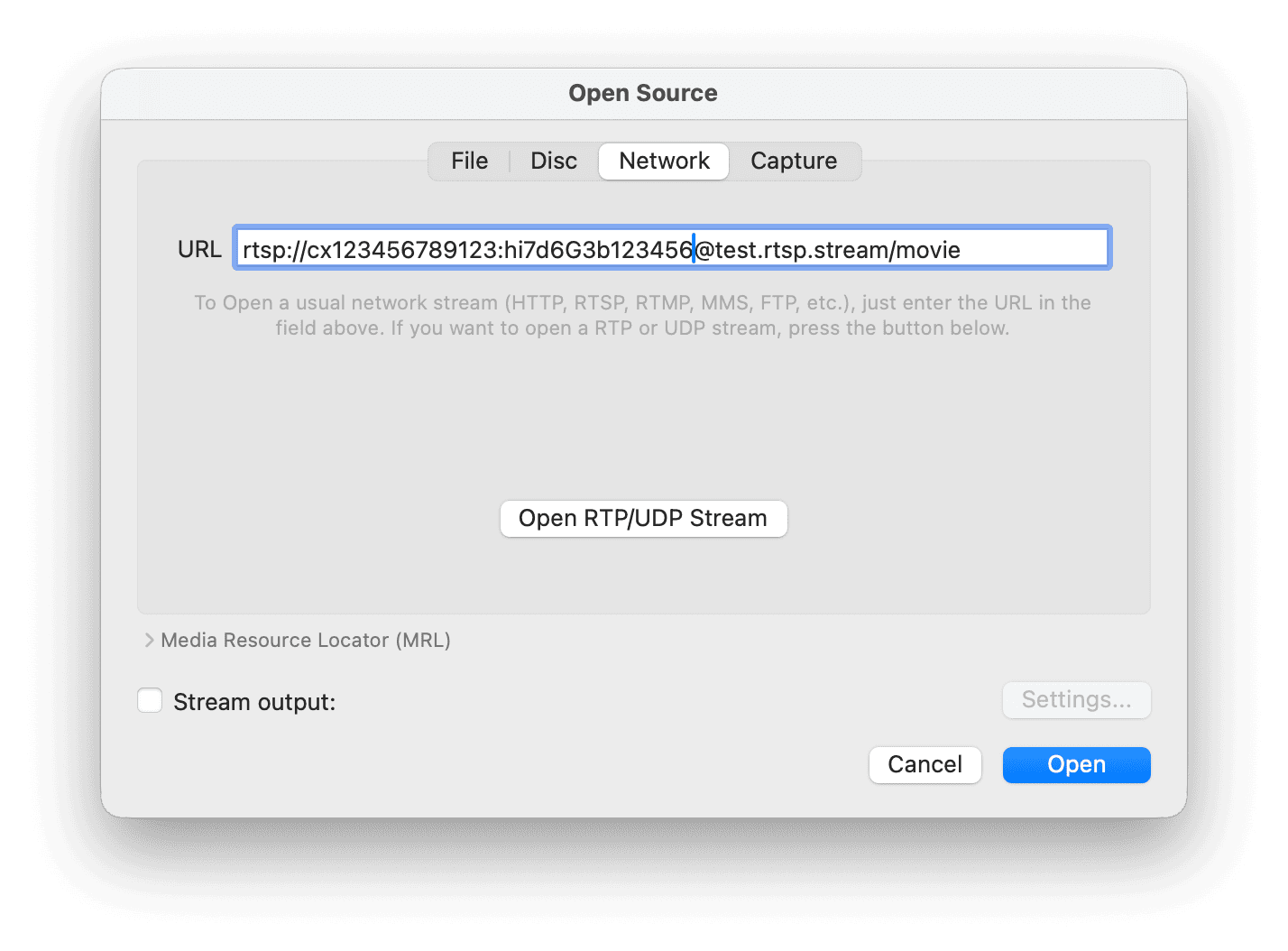 VLC Open Network Stream dialog with an RTSP URL entered in the network URL field.